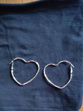 Heart-Shaped Silver Hoop Earrings.